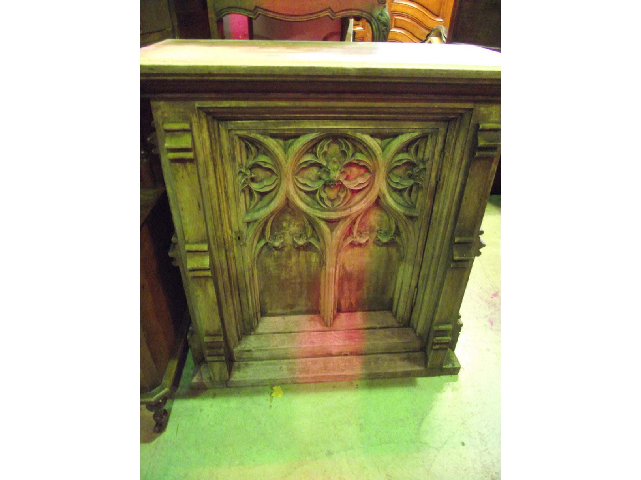 Appraisal: A th century silvered oak ecclesiastical side cupboard the panelled