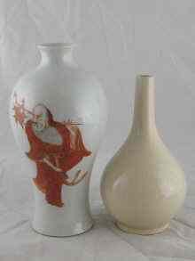 Appraisal: A Chinese ceramic white glazed vase decorated with a red