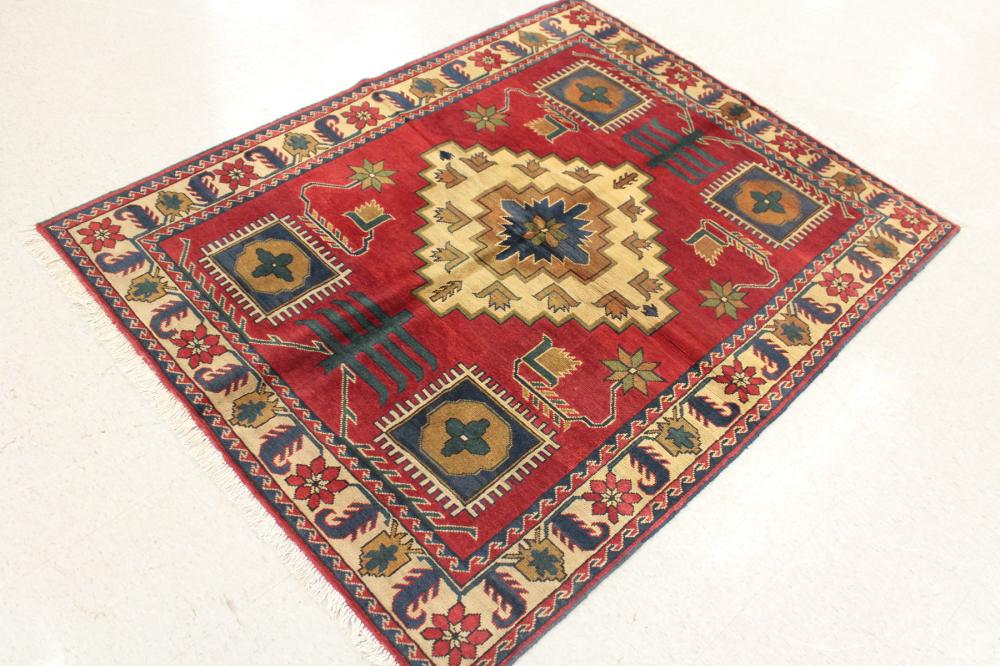 Appraisal: HAND KNOTTED ORIENTAL AREA RUG Pakistani-Persian five geometric tribal medallion