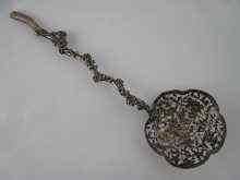 Appraisal: A Chinese silver serving spoon the pierced bowl and the