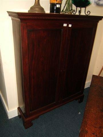 Appraisal: An antique mahogany bookcase cabinet of two panelled doors standing