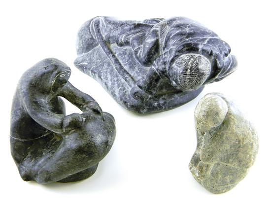 Appraisal: Three th C Canadian Inuit soapstone sculptures female figure with