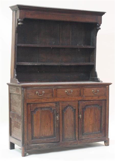 Appraisal: An th century oak dresser and plate rack the projecting