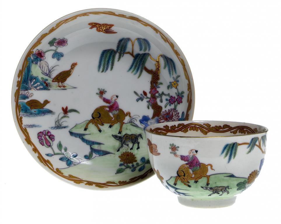 Appraisal: AN UNUSUAL FIRST PERIOD WORCESTER POLYCHROME TEACUP AND A MATCHING