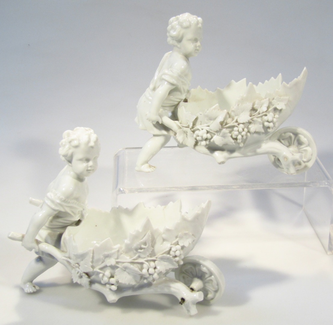 Appraisal: A pair of thC Continental porcelain figures of cherubs pushing