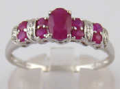 Appraisal: A white metal tests carat gold ruby and diamond ring