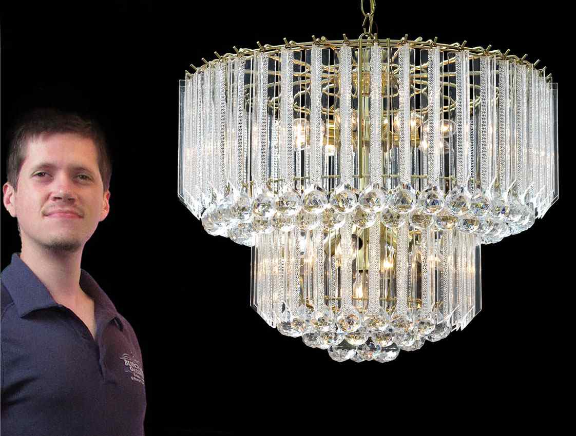 Appraisal: LUCITE AND BRASS TIERED CHANDELIER lights three tiers with brass