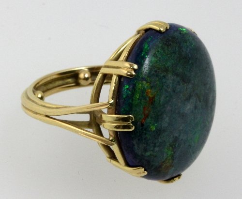 Appraisal: An opal ring the large circular matrix of blue green