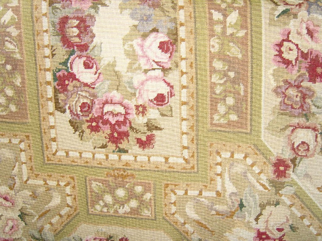 Appraisal: A needlework rug with pink rose and other floral decoration