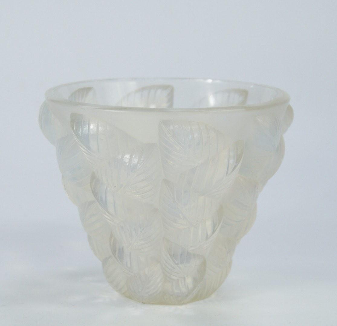 Appraisal: A Lalique opalescent glass vase decorated in the Moissac pattern