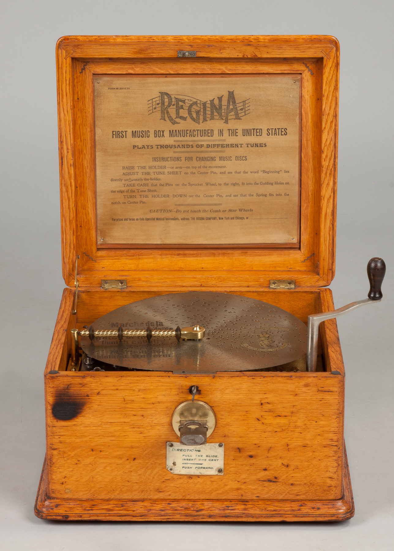 Appraisal: Regina Single Comb Coin-Op Music Box Oak case Original decal