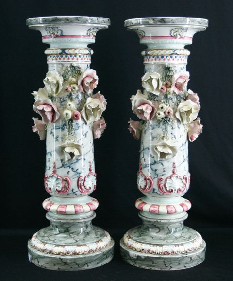 Appraisal: A pair of small ceramic jardiniere stands with applied floral