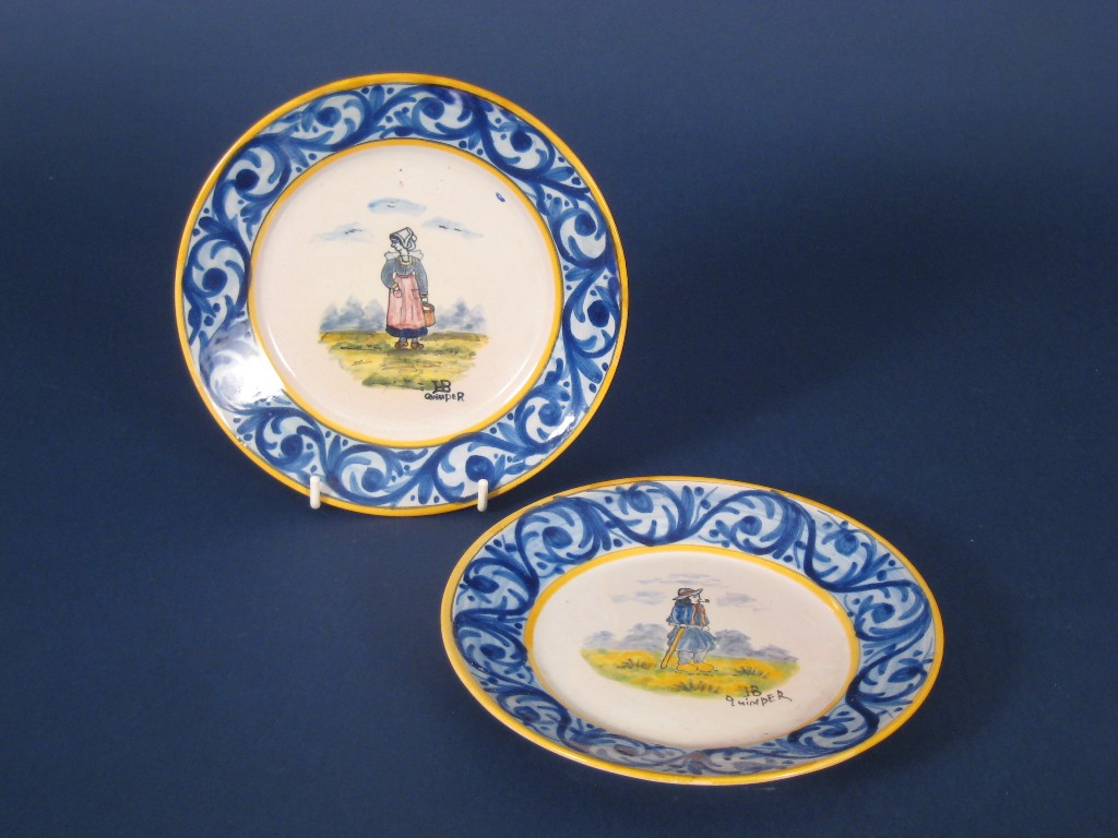 Appraisal: Pair of Quimper small polychrome Plates painted peasants in