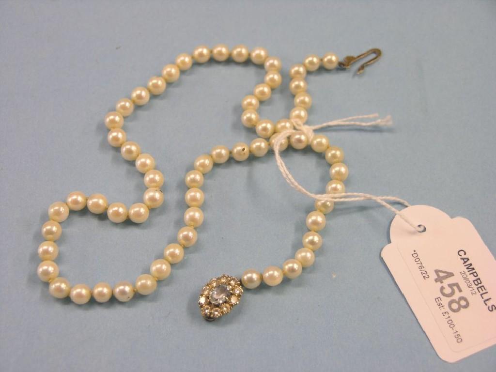 Appraisal: A pearl necklace ct gold pendant mounted with small diamonds