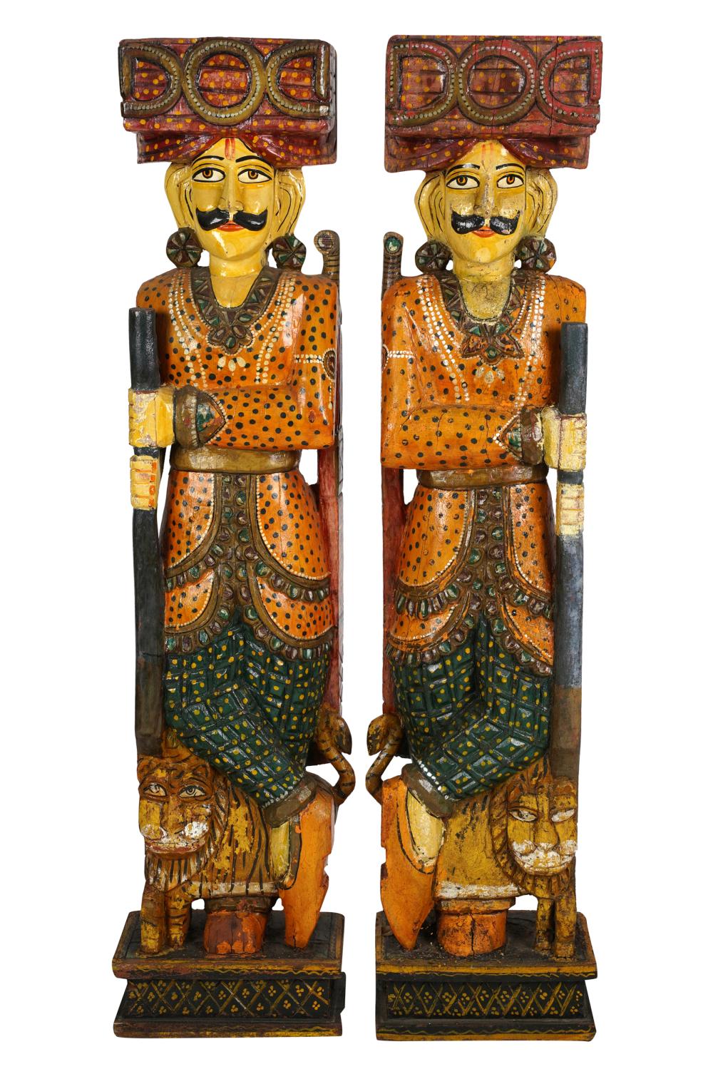 Appraisal: PAIR OF INDIAN CARVED POLYCHROME STANDING FIGURESCondition with loss of