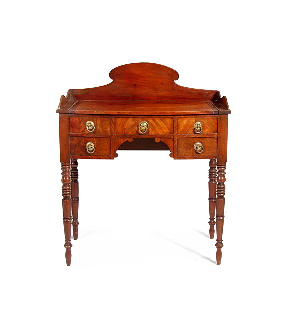 Appraisal: A GEORGE IV MAHOGANY BOW FRONTED KNEEHOLE DRESSING TABLE with