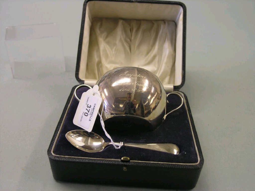 Appraisal: A cased christening pair consisting of two handled silver bowl