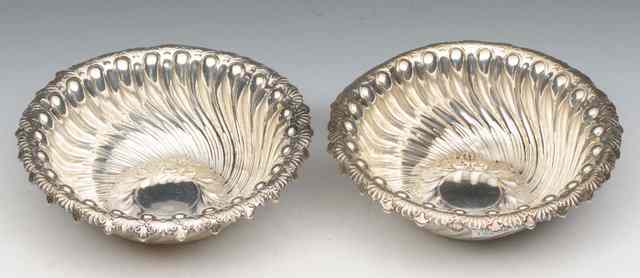 Appraisal: A PAIR OF LATE VICTORIAN SILVER BOWLS with whirlpool decoration