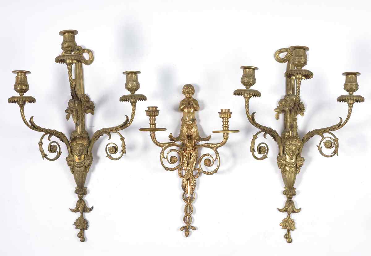 Appraisal: PIECE GILT METAL CANDLE SCONCES To include matched pair foliate