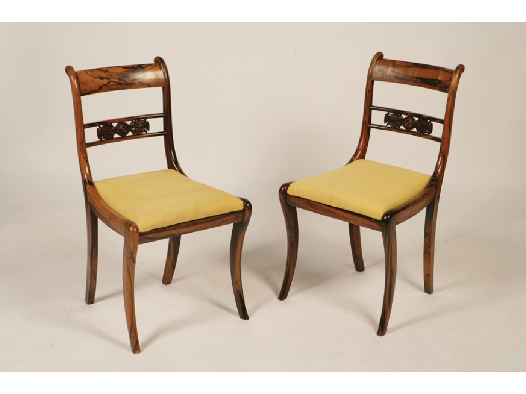 Appraisal: A PAIR OF REGENCY COROMANDEL BAR BACK DINING CHAIRS each