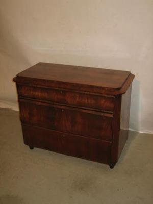 Appraisal: A CONTINENTAL MAHOGANY CHEST of rounded oblong form with moulded