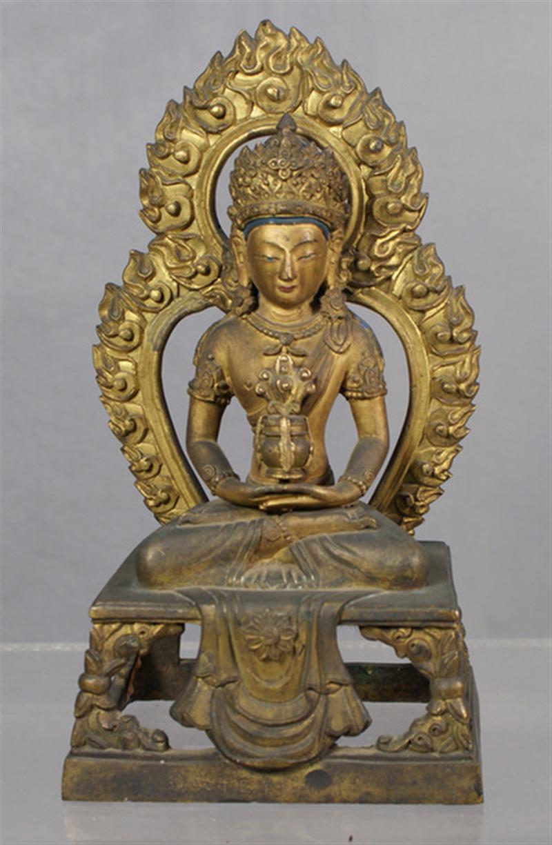 Appraisal: th c Chinese gilt bronze Buddha holding a vase resting