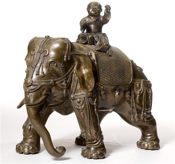 Appraisal: A BRONZE GOOD LUCK CHILD ON AN ELEPHANT China Qing