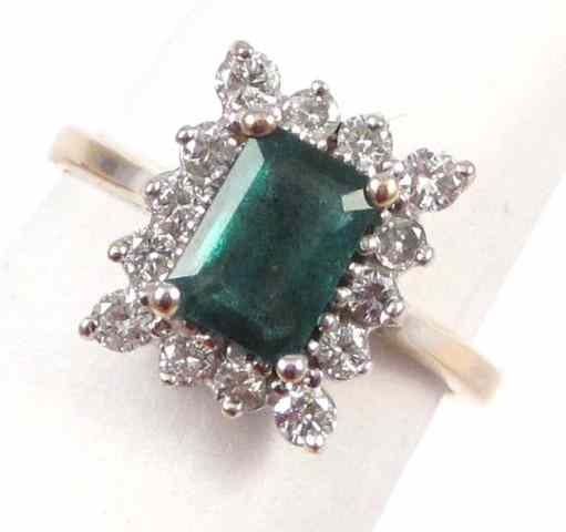 Appraisal: EMERALD DIAMOND AND FOURTEEN KARAT GOLD RING The yellow and