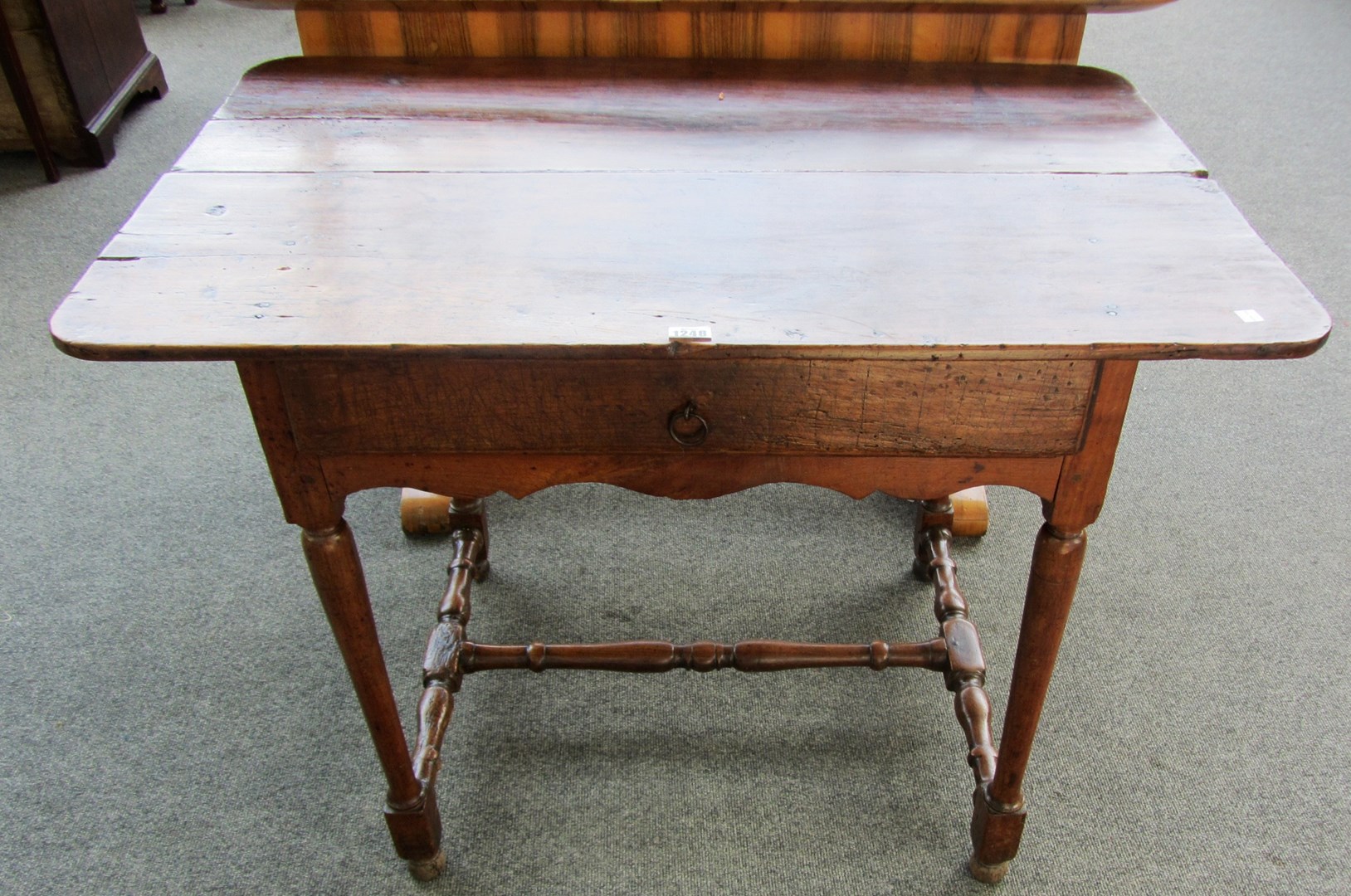 Appraisal: An th century fruitwood side table with single frieze drawer