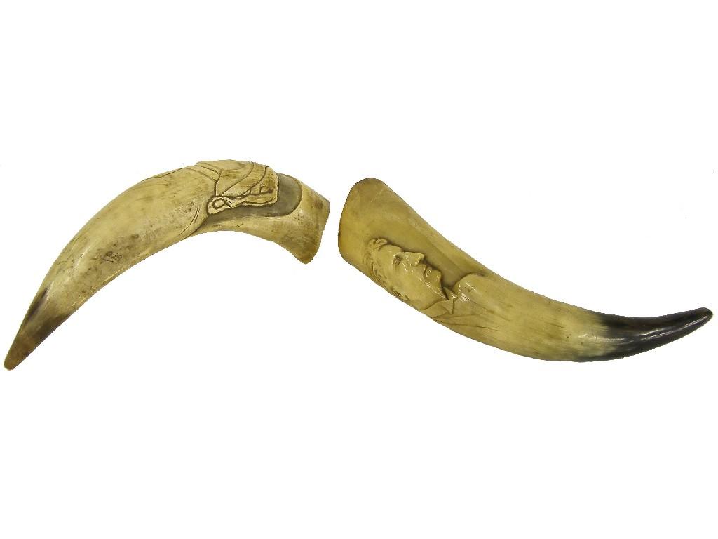 Appraisal: Pair of animal horns each carved with the profile portraits