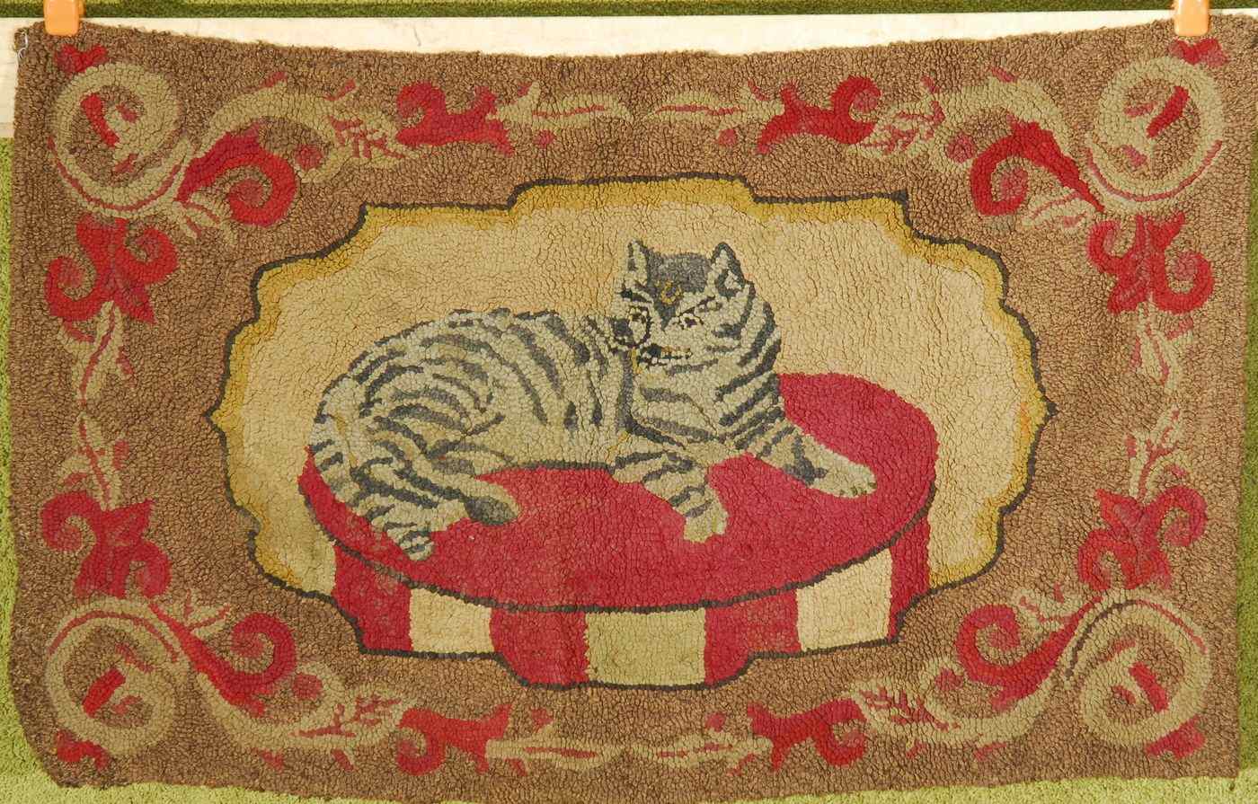 Appraisal: HOOKED RUG x ''Central decoration of a tiger cat resting