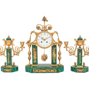 Appraisal: A Gilt Bronze and Malachite Veneered Clock Garniture Early th