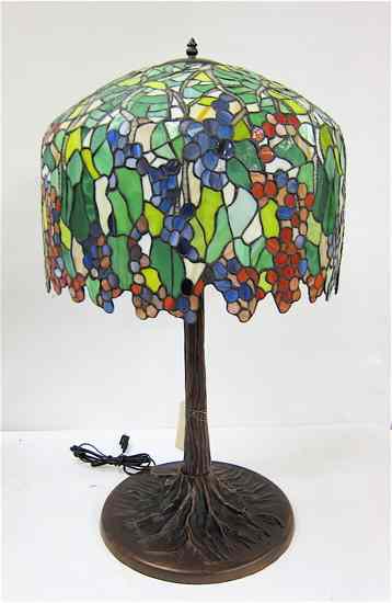 Appraisal: TIFFANY INSPIRED MULTICOLORED GRAPEVINE TABLE LAMP having a colorful grape