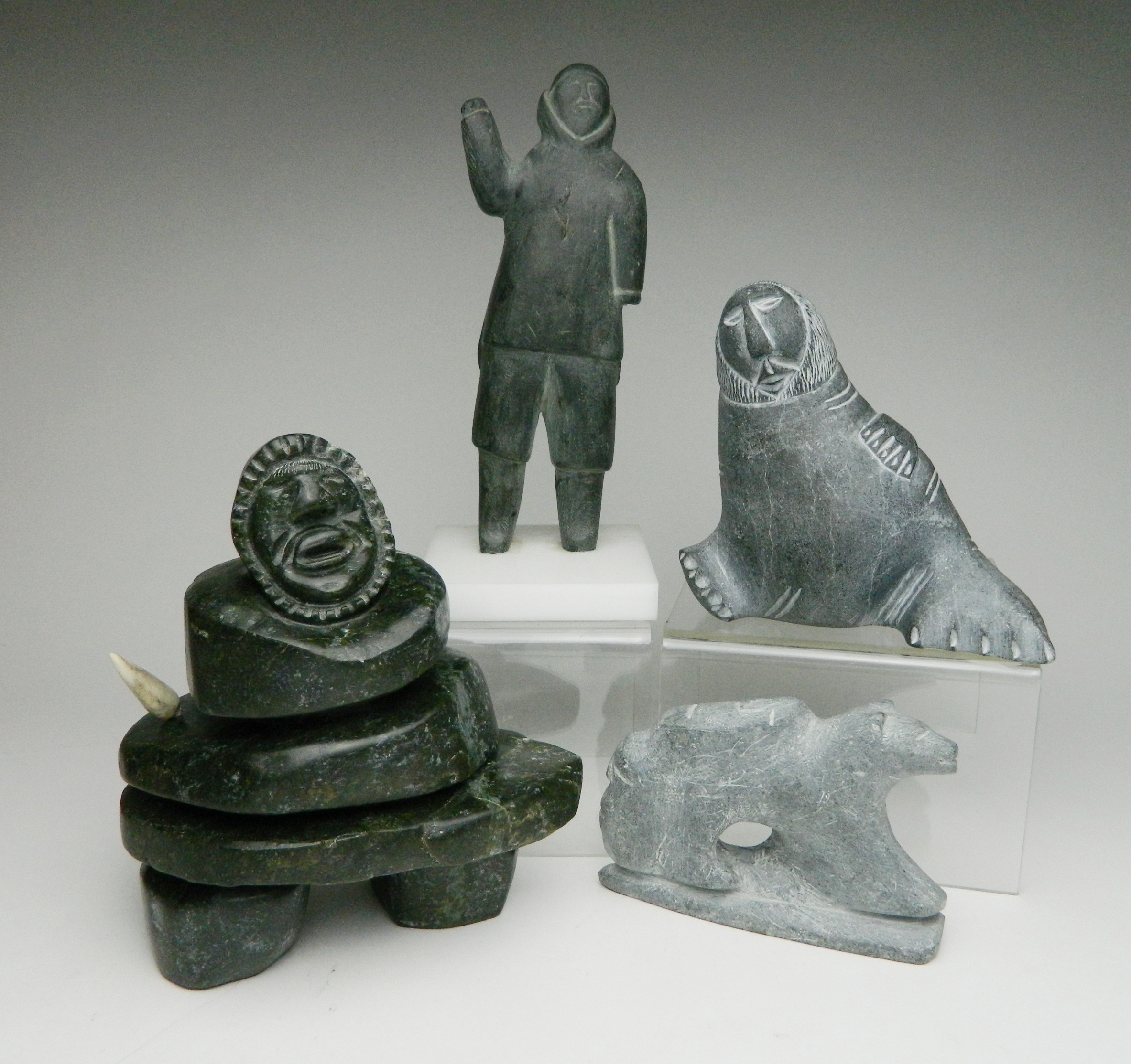 Appraisal: Inuit stone carvings Michael Ariviyut Arviat- Bear and Faces ''h