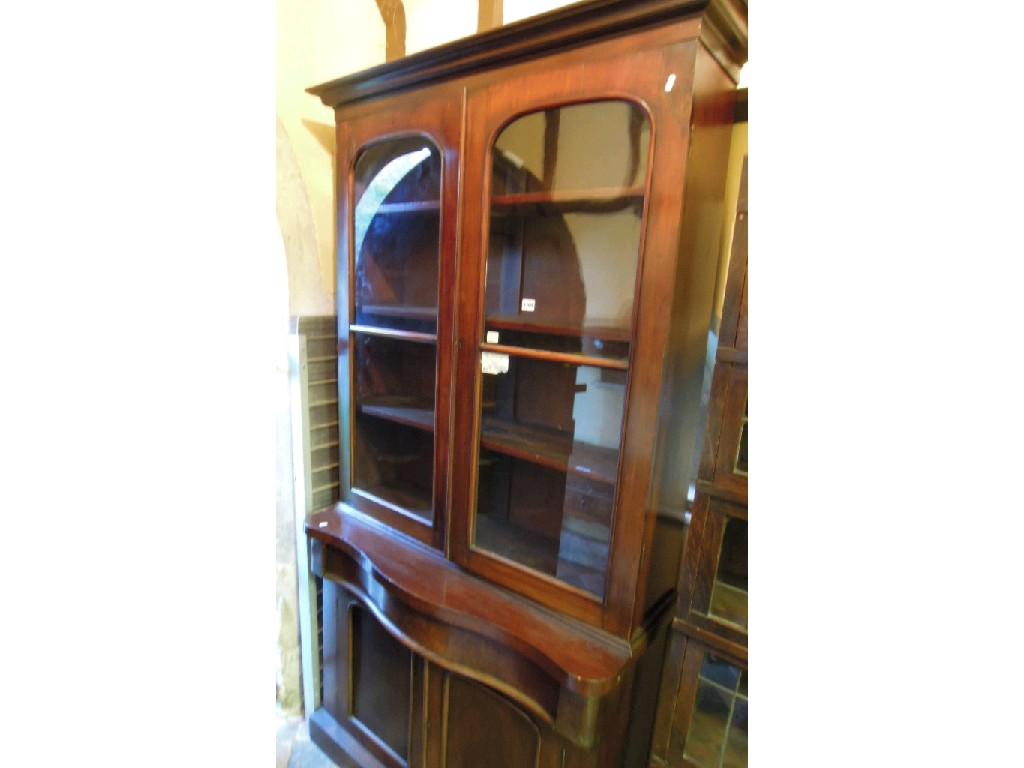 Appraisal: A Victorian mahogany chiffonier bookcase the upper section enclosed by