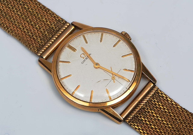 Appraisal: AN OMEGA GILT GENTLEMANS WRIST WATCH the plain dial with