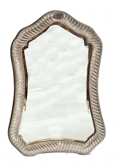 Appraisal: A VICTORIAN SILVER MOUNTED LARGE TABLE MIRROR of waisted form