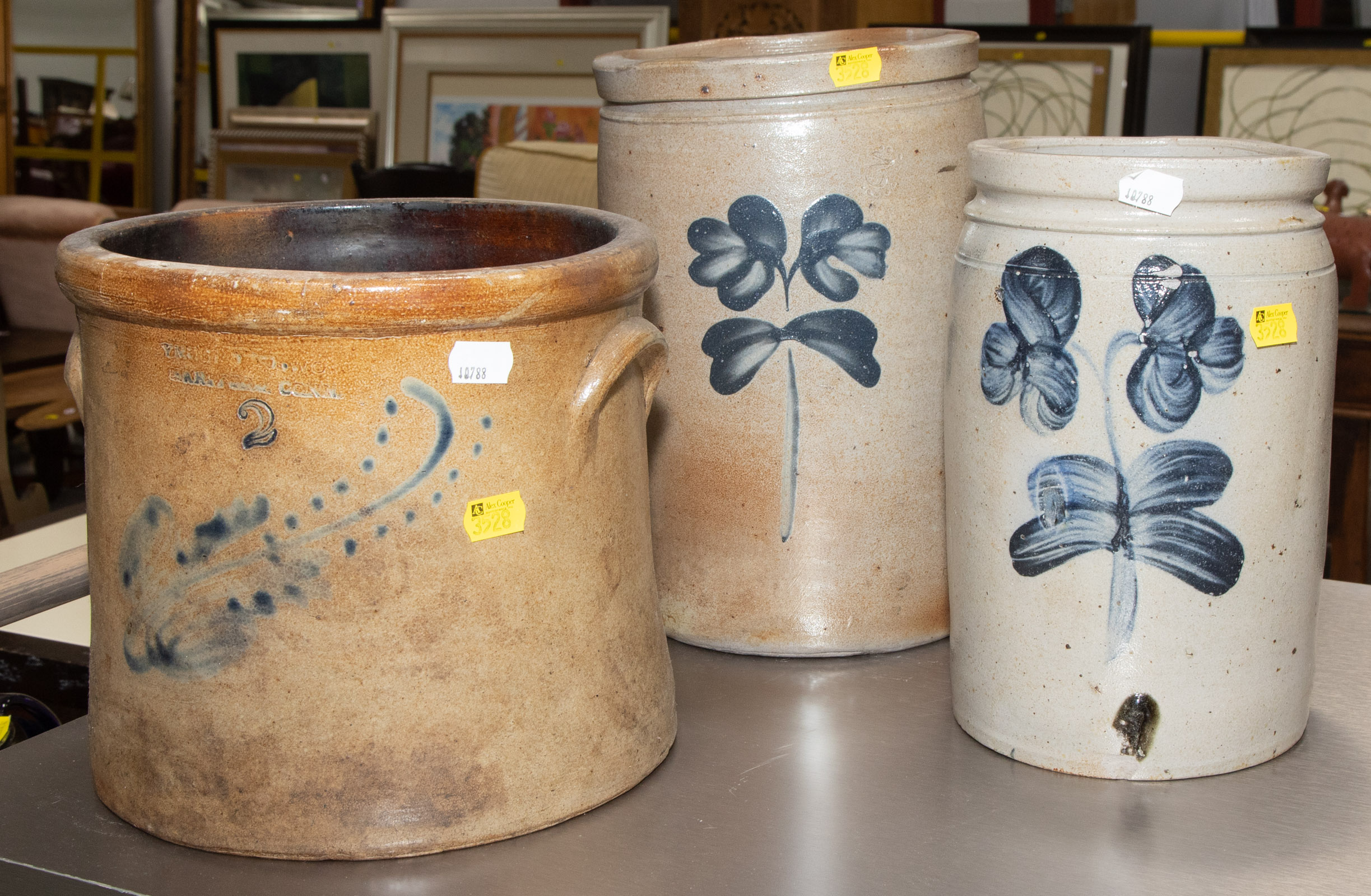 Appraisal: THREE COBALT DECORATED SALT GLAZED CROCKS th century one gallon