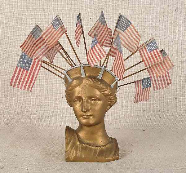 Appraisal: Plaster lady liberty bust with flags together with two Schoenhut