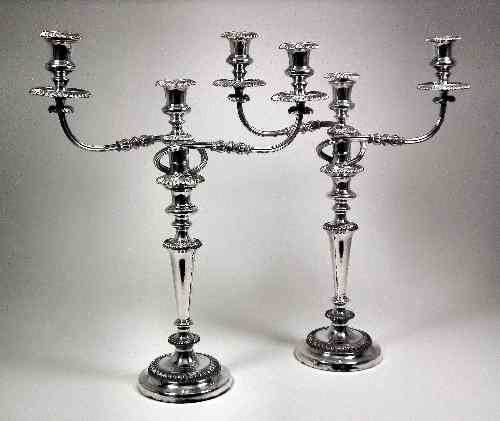 Appraisal: A pair of th Century plated three light candelabra with