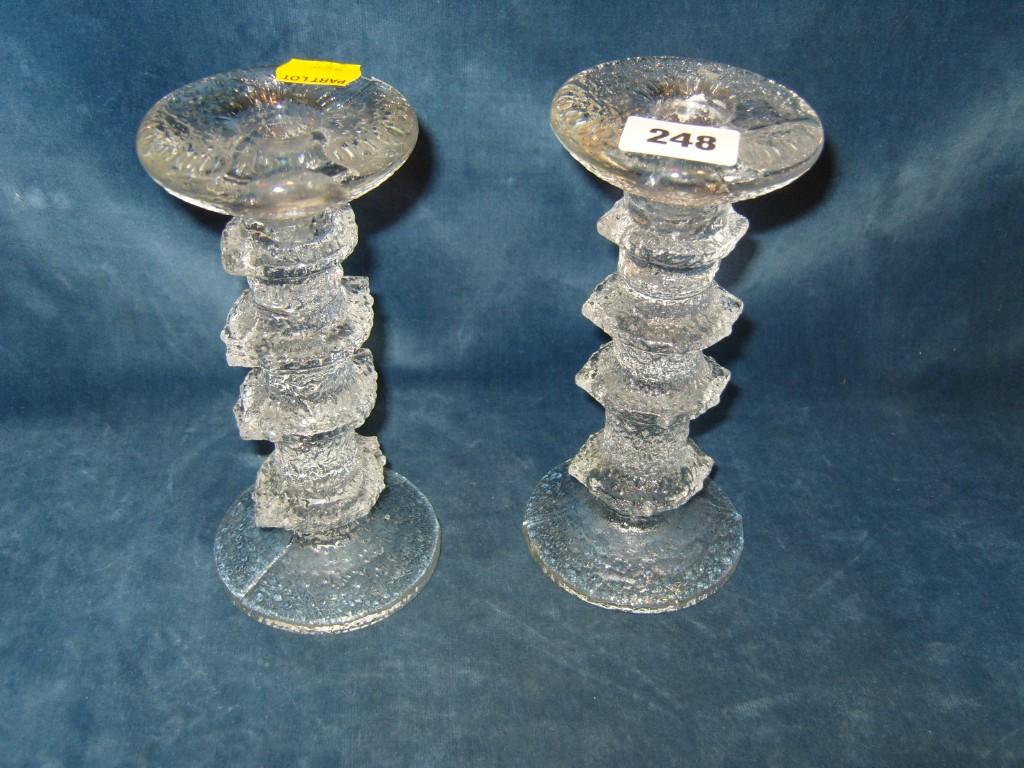 Appraisal: A pair of frosted glass candlesticks with knopped stems and