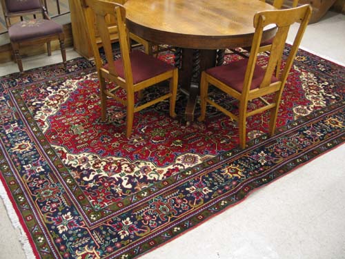 Appraisal: PERSIAN TABRIZ CARPET stylized floral and central floral medallion design