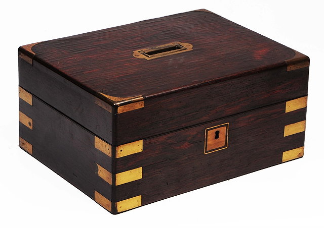 Appraisal: A Victorian rosewood and brass bound workboxwith sunk brass handle