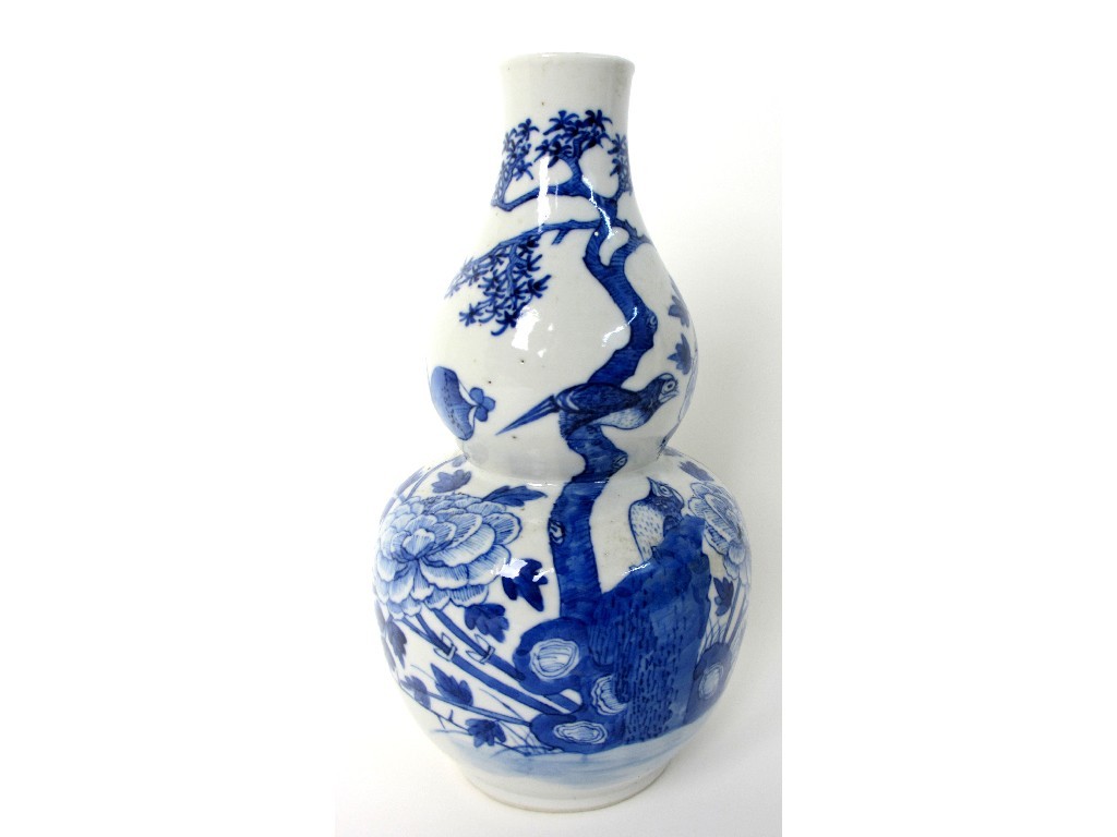 Appraisal: A Chinese blue and white double gourd vase painted with