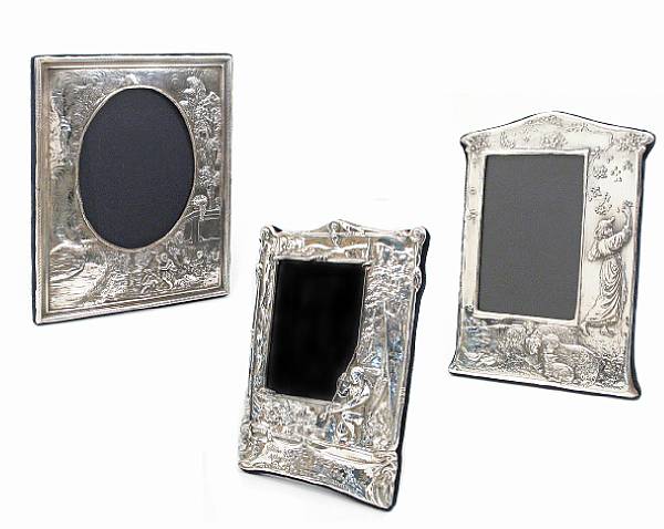 Appraisal: A group of three silver faced photo frames after the