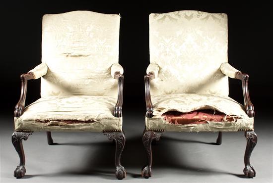 Appraisal: Pair of Chippendale style carved mahogany upholstered lolling chairs early