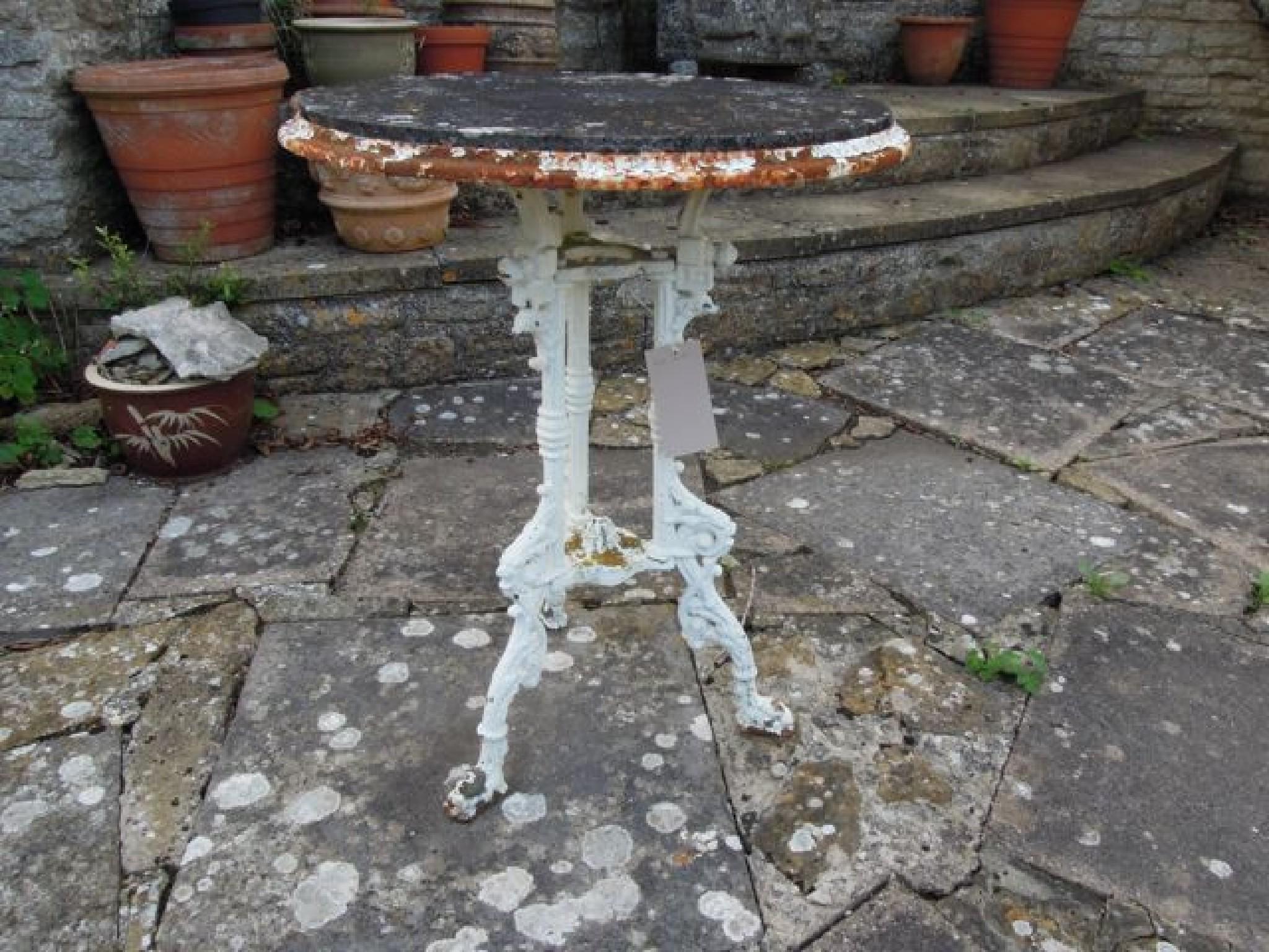 Appraisal: A Victorian cast iron table the circular top raised on