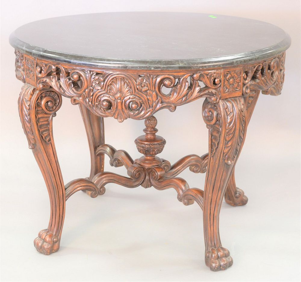 Appraisal: Round carved center table with veneer granite top ht dia