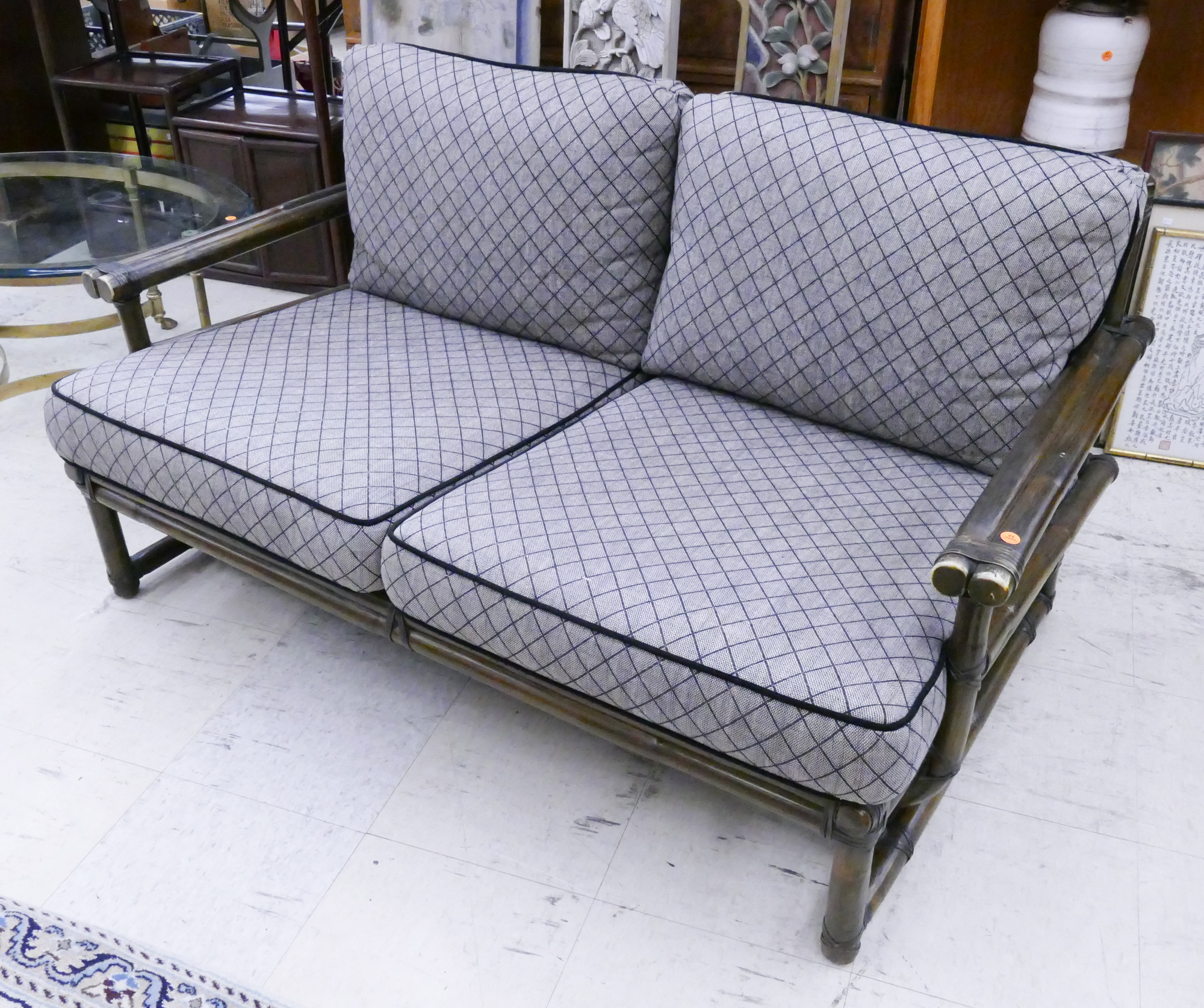 Appraisal: McGuire Dark Rattan Love Settee- x x ''