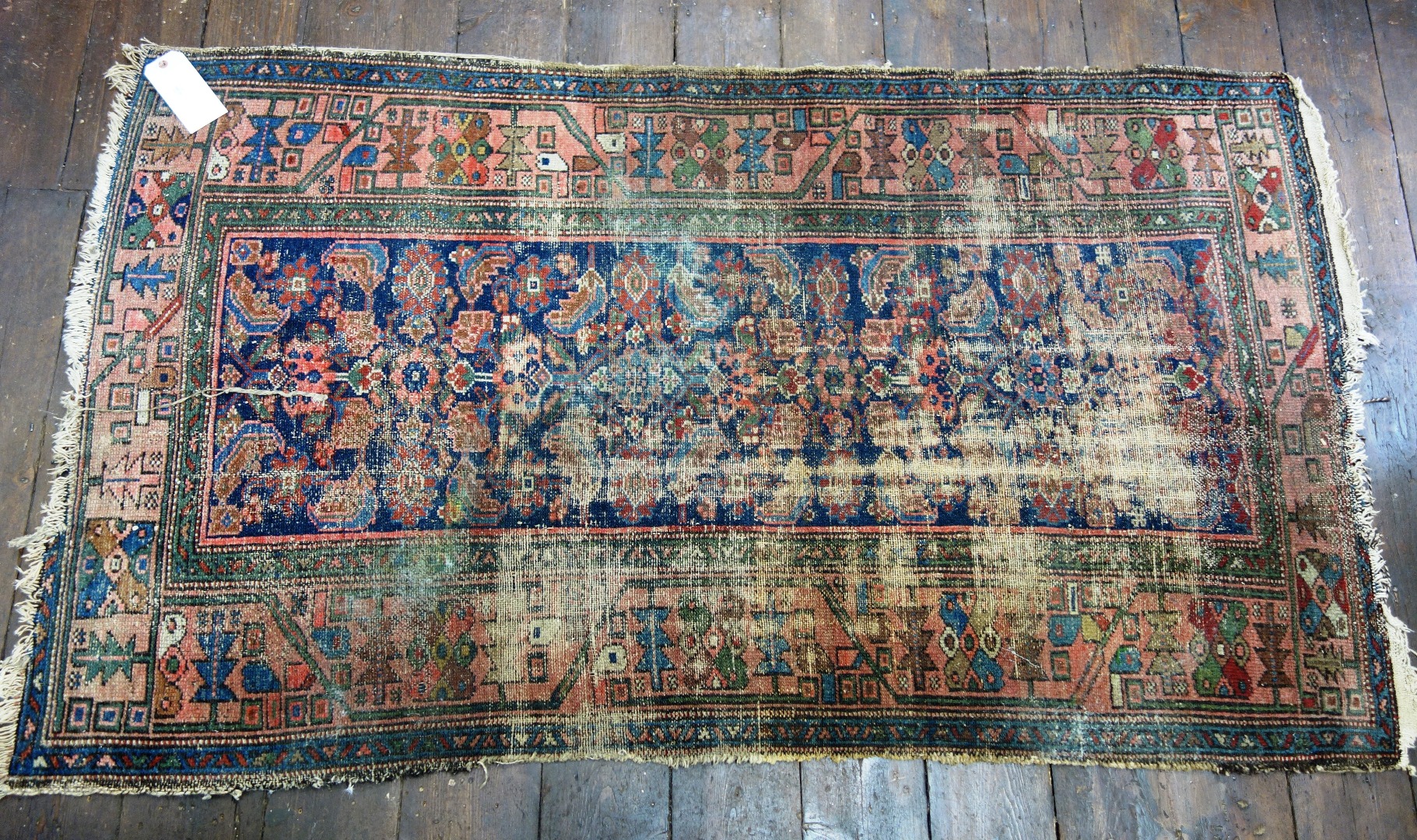 Appraisal: A Belouch carpet with repeated lozenges and arrow motifs cm